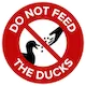 Sign reading 'Don't Feed The Ducks'
